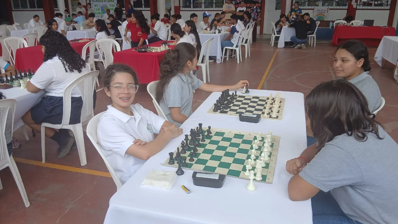 Girls competing in chess tournament