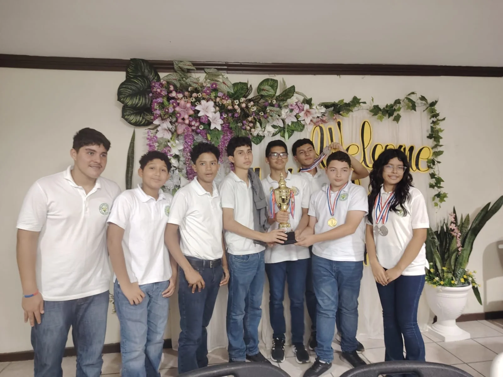 Brassavola chess students holding a trophy