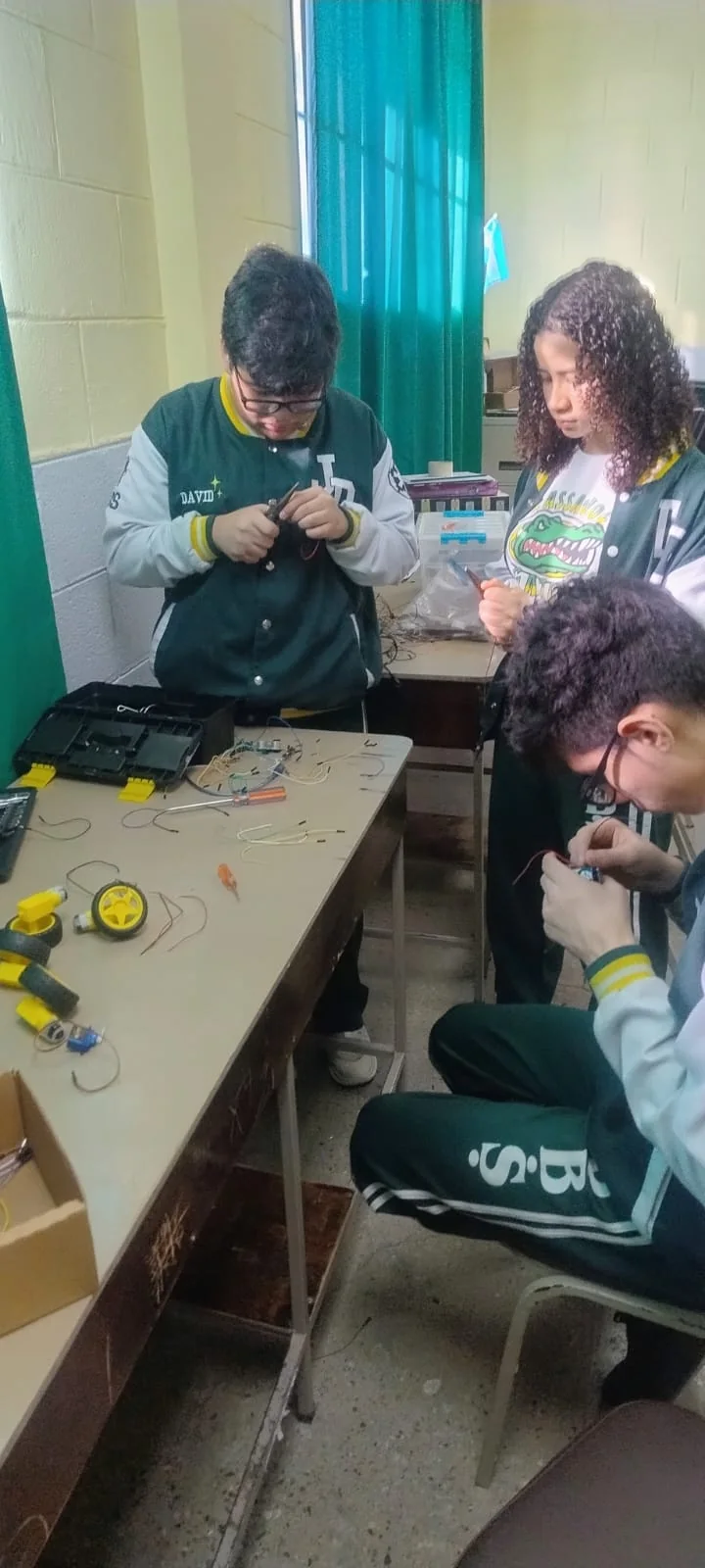 Students working on robot mechanics