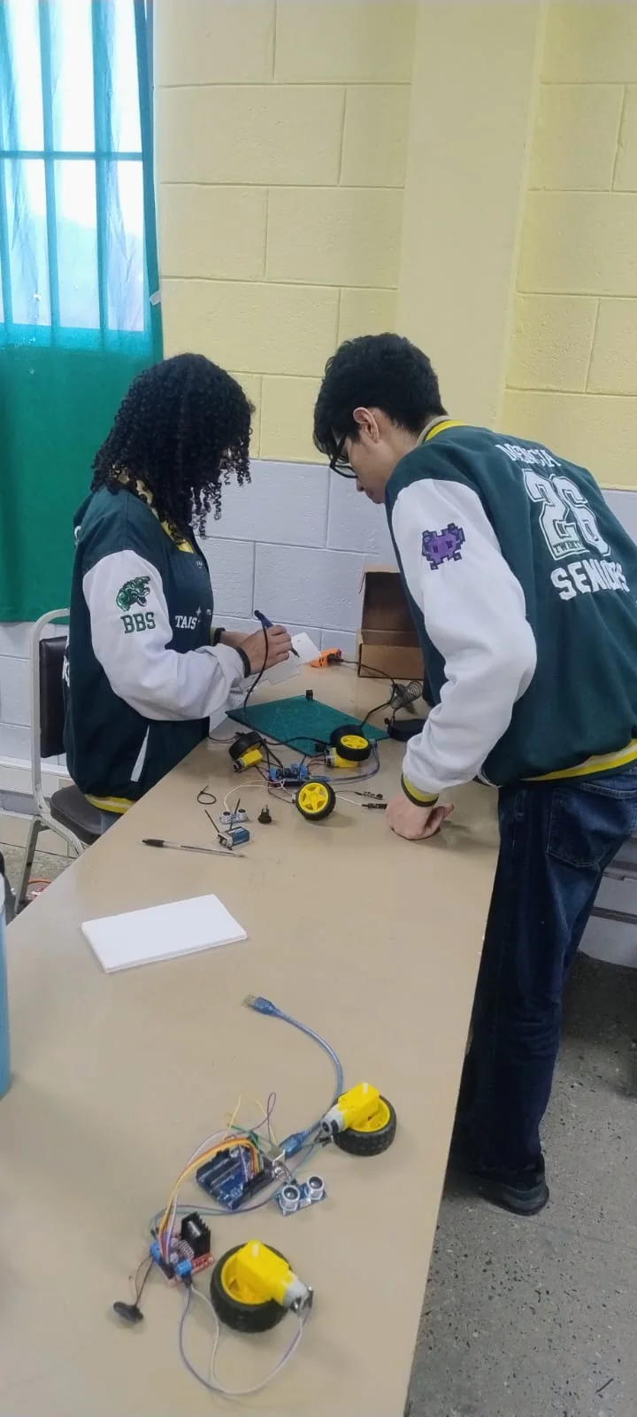 Senior students assembling robotics projects