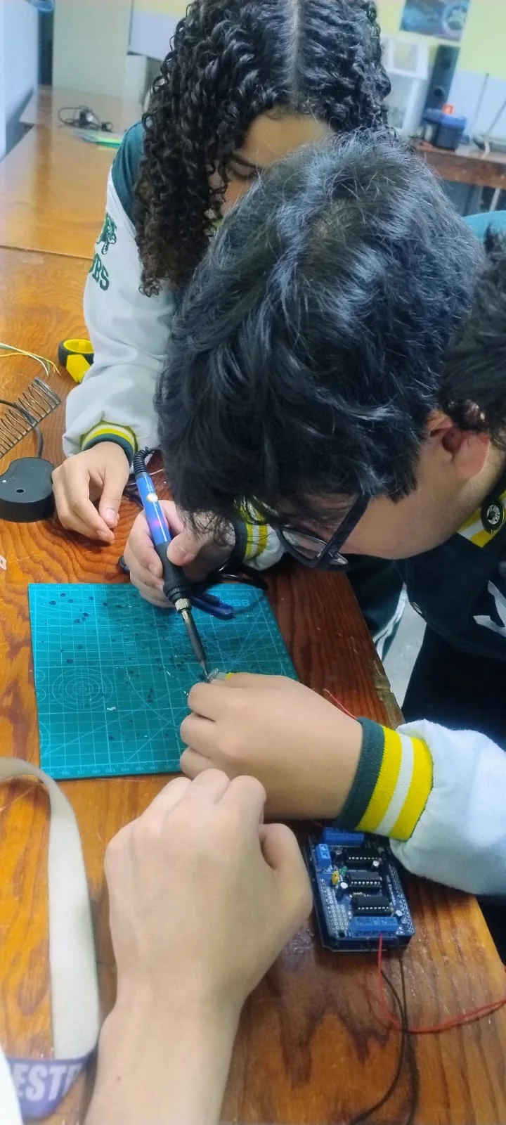 Student practicing electronics and soldering