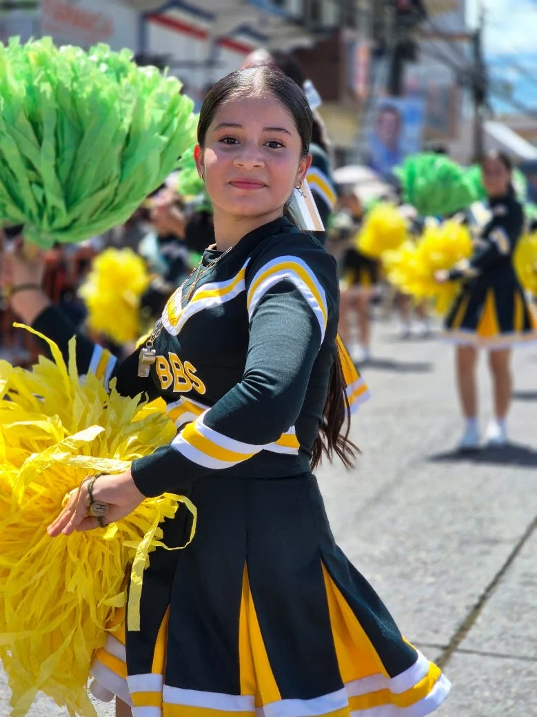Cheerleader posing with Brassavola colors